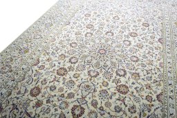 Backside of handmade 2000s Kashan rug showing knot structure and weave density