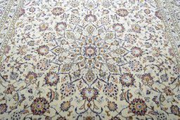 Central medallion detail of 2000s Kashan rug from Iran / Persia