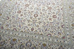 Close-up detail of 2000s Kashan rug from Iran / Persia showing Wool weave