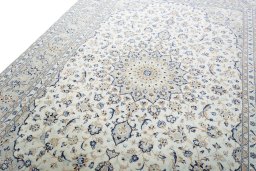 Backside of handmade New Kashan rug showing knot structure and weave density