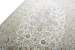 Backside of handmade 2000s Kashan rug showing knot structure and weave density