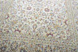 Close-up detail of 2000s Kashan rug from Iran / Persia showing Wool weave