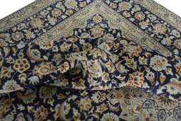Surface texture of 2000s Kashan rug with natural Wool and intricate pattern