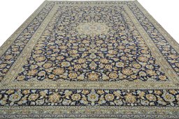 Surface texture of 2000s Kashan rug with natural Wool and intricate pattern