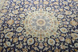 Central medallion detail of 2000s Kashan rug from Iran / Persia