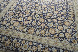 Close-up detail of 2000s Kashan rug from Iran / Persia showing Wool weave