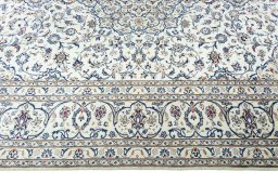 Corner detail of 2000s Kashan rug showing border pattern and Wool pile