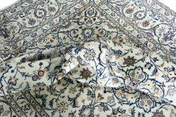 Surface texture of 2000s Kashan rug with natural Wool and intricate pattern