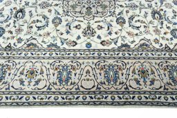 Corner detail of New Kashan rug showing border pattern and Wool pile
