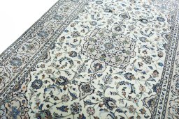 Backside of handmade New Kashan rug showing knot structure and weave density