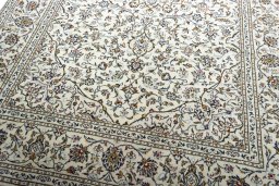 Close-up detail of 2000s Kashan rug from Iran / Persia showing Wool weave