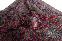 Backside of handmade 1930s Kashan rug showing knot structure and weave density