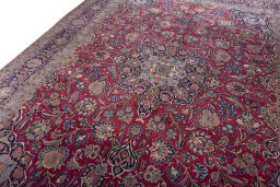 Backside of handmade 1930s Kashan rug showing knot structure and weave density