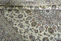 Close-up detail of 2000s Kashan rug from Iran / Persia showing Wool weave