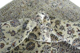 Surface texture of 2000s Kashan rug with natural Wool and intricate pattern