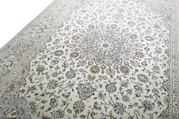 Backside of handmade 2000s Kashan rug showing knot structure and weave density