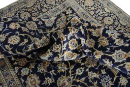 Surface texture of 2000s Kashan rug with natural Wool and intricate pattern