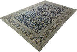 Corner detail of 2000s Kashan rug showing border pattern and Wool pile