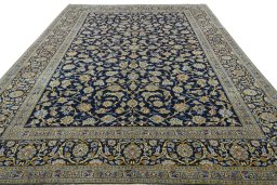 Surface texture of 2000s Kashan rug with natural Wool and intricate pattern