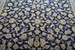 Central medallion detail of 2000s Kashan rug from Iran / Persia