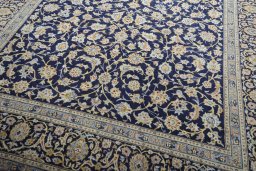Close-up detail of 2000s Kashan rug from Iran / Persia showing Wool weave