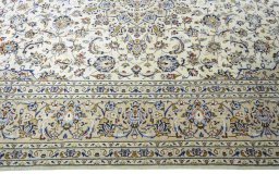 Corner detail of New Kashan rug showing border pattern and Wool pile