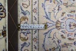 Backside of handmade New Kashan rug showing knot structure and weave density