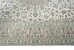 Corner detail of 2000s Kashan rug showing border pattern and Wool pile