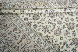 Close-up detail of 2000s Kashan rug from Iran / Persia showing Wool weave