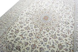 Backside of handmade 2000s Kashan rug showing knot structure and weave density