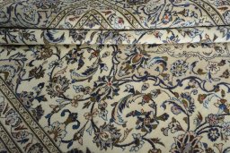 Close-up detail of 2000s Kashan rug from Iran / Persia showing Wool weave