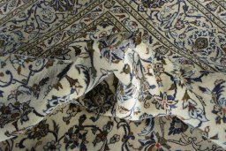 Surface texture of 2000s Kashan rug with natural Wool and intricate pattern