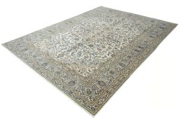 Corner detail of 2000s Kashan rug showing border pattern and Wool pile