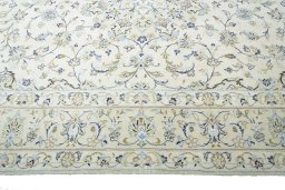 Corner detail of New Kashan rug showing border pattern and Wool pile