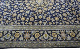 Corner detail of 2000s Kashan rug showing border pattern and Wool pile