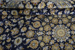 Close-up detail of 2000s Kashan rug from Iran / Persia showing Wool weave