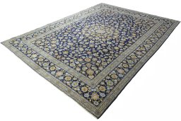 Corner detail of 2000s Kashan rug showing border pattern and Wool pile