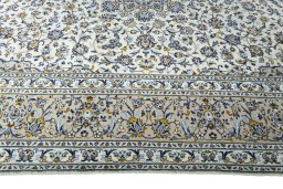 Corner detail of 2000s Kashan rug showing border pattern and Wool pile