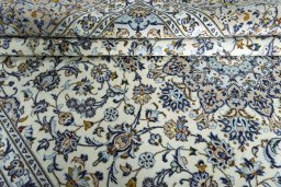 Close-up detail of 2000s Kashan rug from Iran / Persia showing Wool weave
