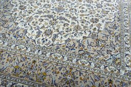 Close-up detail of 2000s Kashan rug from Iran / Persia showing Wool weave