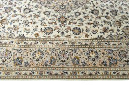 Corner detail of 2000s Kashan rug showing border pattern and Wool pile
