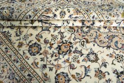Close-up detail of 2000s Kashan rug from Iran / Persia showing Wool weave
