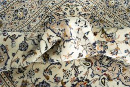 Surface texture of 2000s Kashan rug with natural Wool and intricate pattern