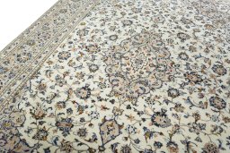 Backside of handmade 2000s Kashan rug showing knot structure and weave density