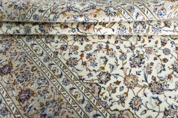 Close-up detail of 2000s Kashan rug from Iran / Persia showing Wool weave