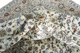 Surface texture of 2000s Kashan rug with natural Wool and intricate pattern