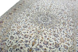 Backside of handmade 2000s Kashan rug showing knot structure and weave density