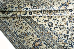 Close-up detail of 2000s Kashan rug from Iran / Persia showing Wool weave
