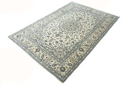 Corner detail of 2000s Kashan rug showing border pattern and Wool pile
