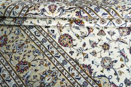 Close-up detail of 2000s Kashan rug from Iran / Persia showing Wool weave